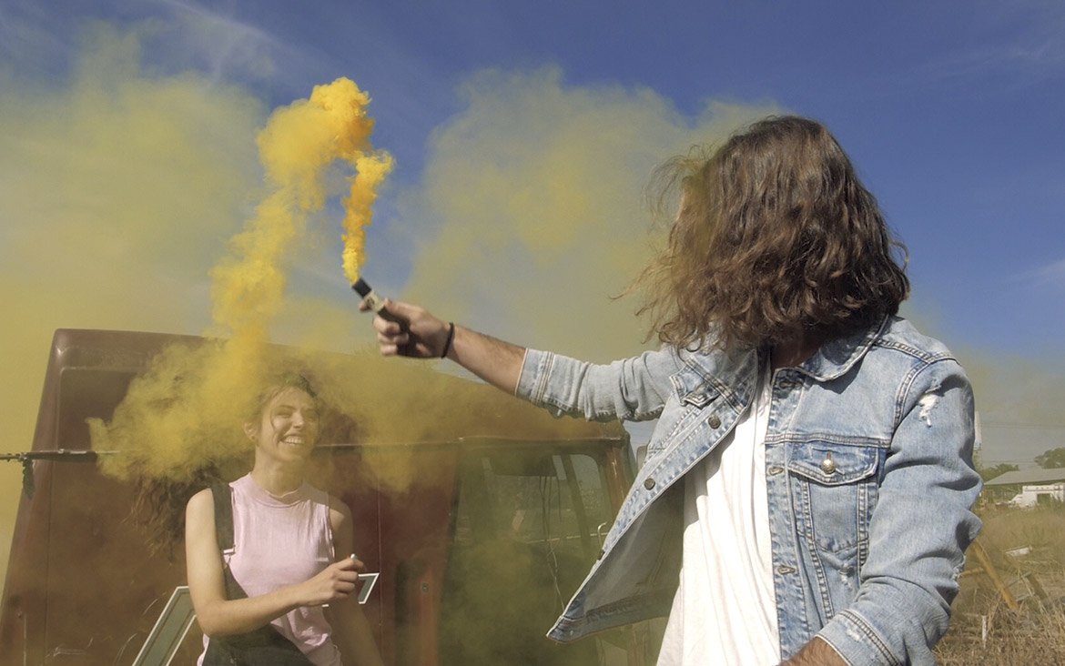 Playing with a yellow smoke bomb